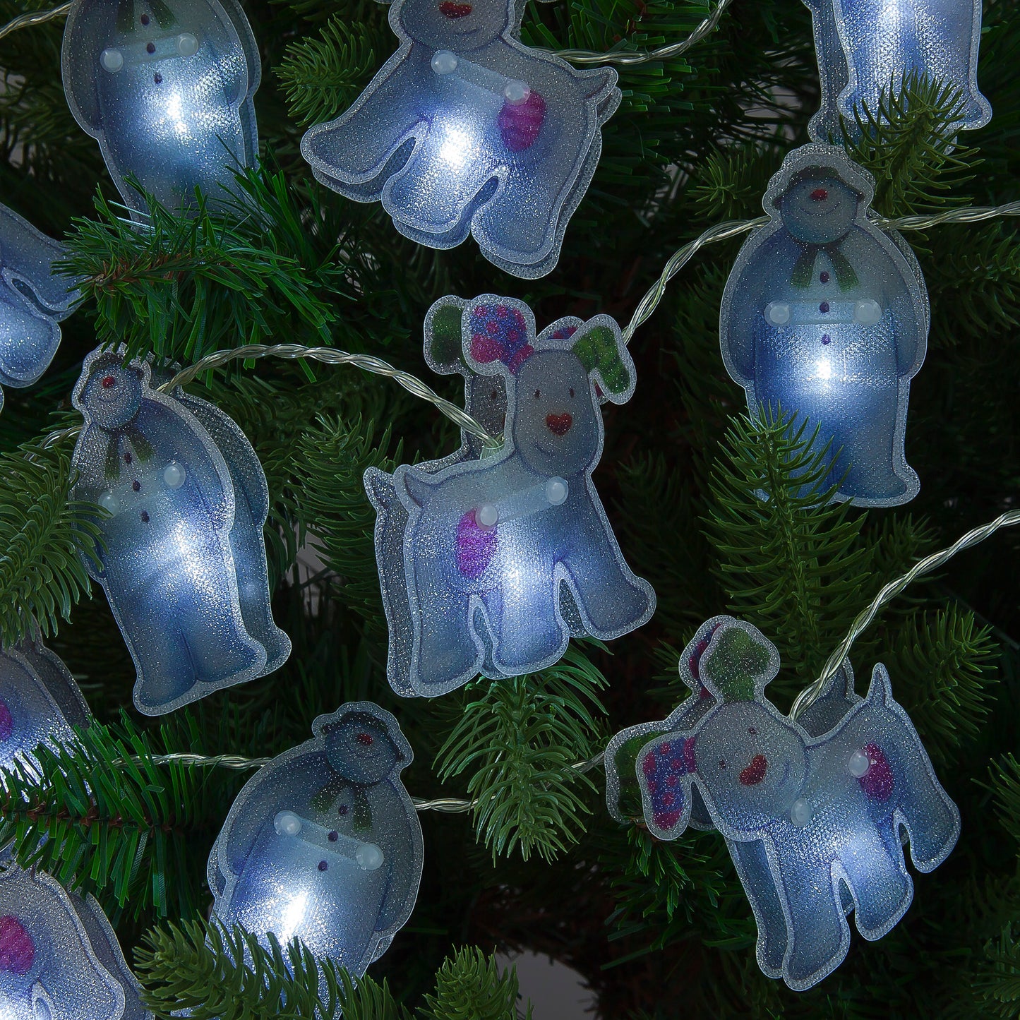 String lights shaped like cartoon dogs on a Christmas tree.