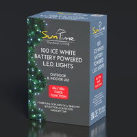 Box of SunTime outdoor LED lights with green string lights on a dark background