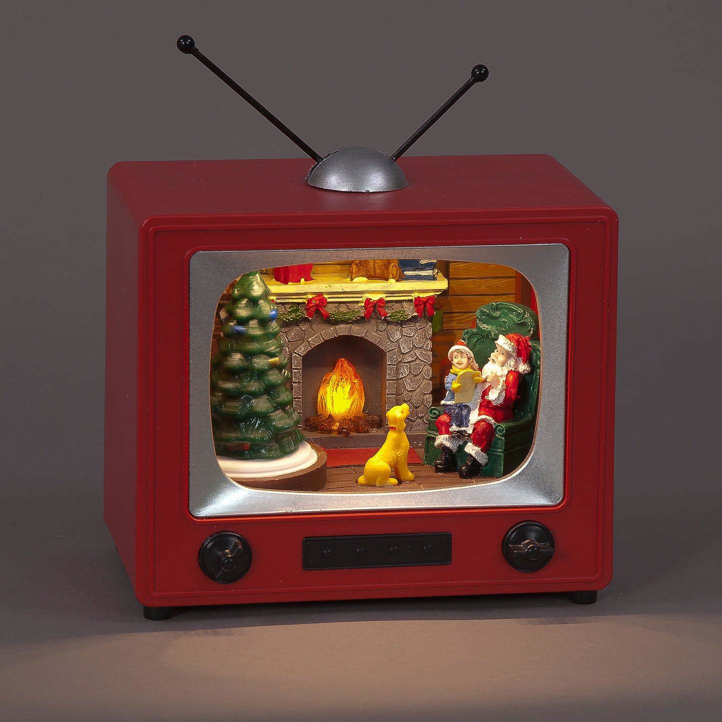 Red vintage-style TV with a Christmas scene inside, featuring Santa Claus and a dog by a fireplace.