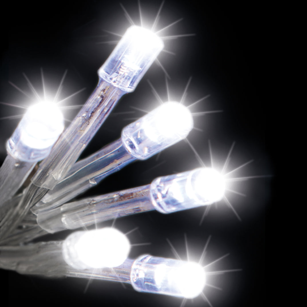 A bundle of battery-operated LED static lights in ice white, with visible clear cables and white bulbs, sparkling against a dark background.
