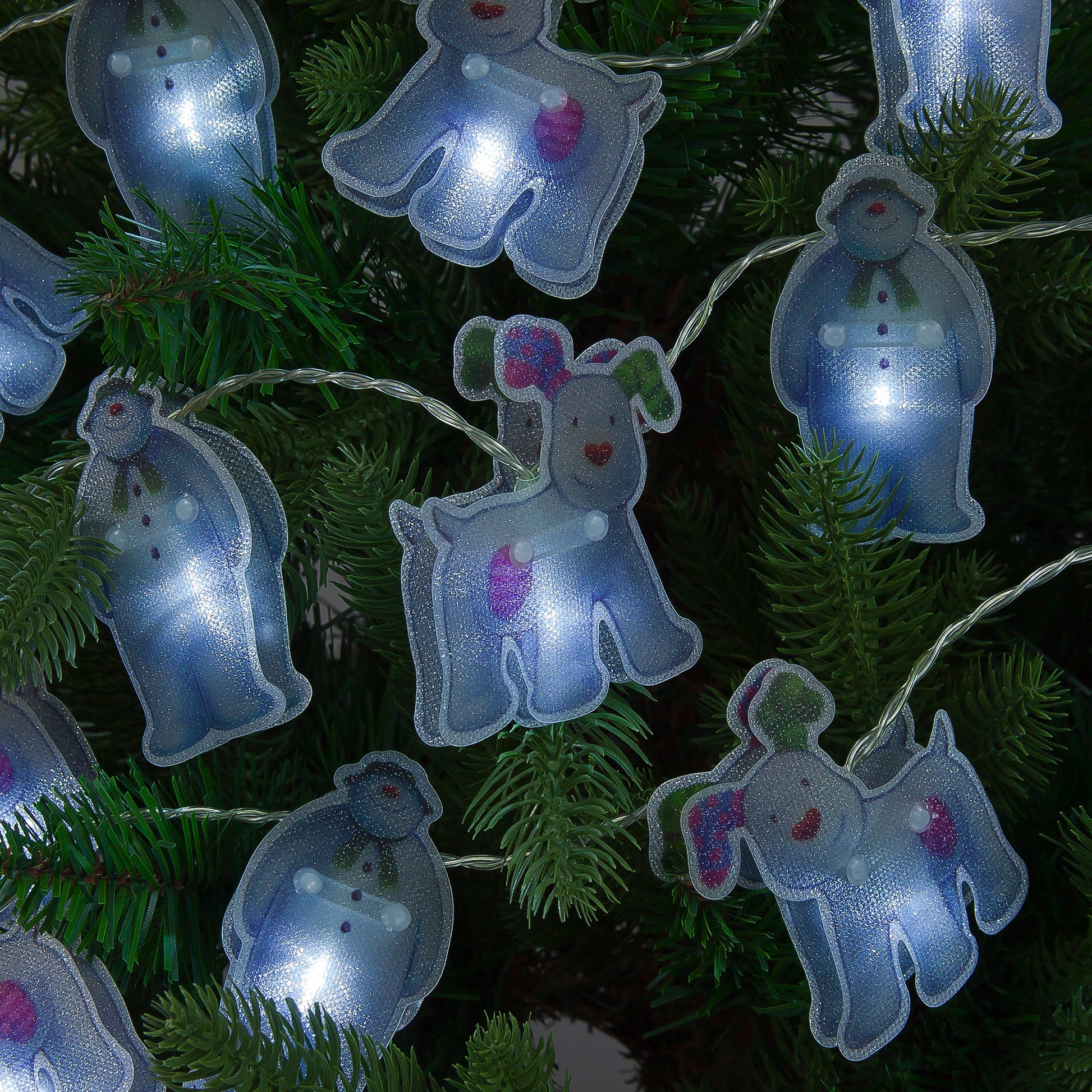 String lights shaped like cartoon dogs on a Christmas tree.