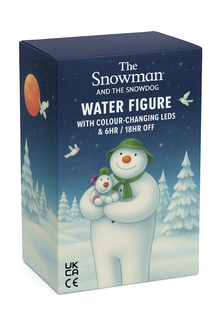 Box packaging of 'The Snowman and the Snowdog' water figure with color-changing LEDs on a snowy night background.
