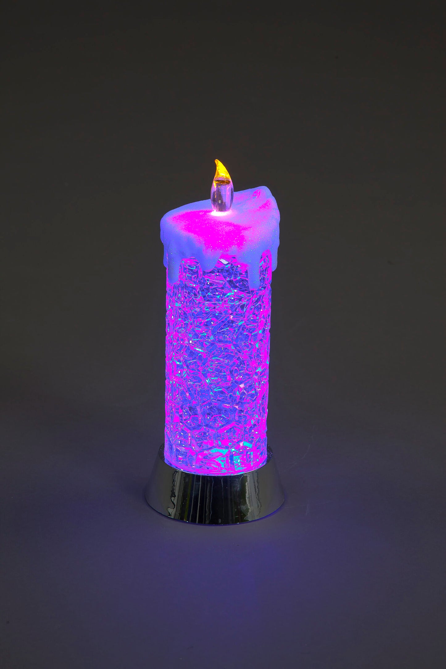 Colorful LED candle on a dark background