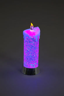 Colorful LED candle on a dark background