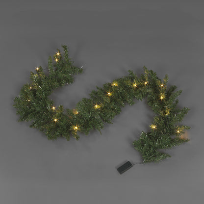 A pre-lit Christmas garland made of green foliage with warm white LED lights, displayed on a gray background. The garland appears to be hanging and has a remote control for the lights.